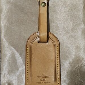 2 piece Louis Vuitton luggage tag and leather strap